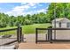 Backyard view featuring a deck with an outdoor kitchen and patio area at 9231 E Poynter Dr, Morgantown, IN 46160