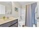 Well-lit bathroom featuring a shower, vanity, and neutral decor at 9231 E Poynter Dr, Morgantown, IN 46160