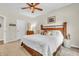 Spacious bedroom with neutral walls, carpet flooring and a wooden headboard design at 9231 E Poynter Dr, Morgantown, IN 46160