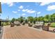 Expansive deck with wicker seating, side tables, and greenery, perfect for outdoor entertaining and enjoying serene views at 9231 E Poynter Dr, Morgantown, IN 46160