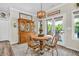Charming dining area with a wooden table, stylish chairs, and a classic china cabinet at 9231 E Poynter Dr, Morgantown, IN 46160