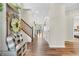 Bright foyer boasts hardwood floors, decorative accents, and an inviting view of the home's layout at 9231 E Poynter Dr, Morgantown, IN 46160