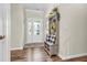 Inviting foyer with hardwood floors, decorative furnishings, and ample natural light at 9231 E Poynter Dr, Morgantown, IN 46160
