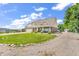 Spacious home featuring a well-manicured lawn, mature trees, and long driveway at 9231 E Poynter Dr, Morgantown, IN 46160