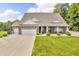 Charming brick home with a three-car garage, well-manicured lawn, and welcoming curb appeal at 9231 E Poynter Dr, Morgantown, IN 46160
