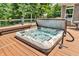 Inviting hot tub on wooden deck, great for relaxation and enjoying the outdoors in privacy at 9231 E Poynter Dr, Morgantown, IN 46160