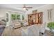 Inviting living room with a ceiling fan, plush seating, and a stylish entertainment center at 9231 E Poynter Dr, Morgantown, IN 46160