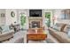 Living room with fireplace is well lit with a comfortable seating arrangement and decor at 9231 E Poynter Dr, Morgantown, IN 46160