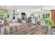 Sun-lit open-concept living space offers comfortable seating, a dining table, and seamless indoor-outdoor flow at 9231 E Poynter Dr, Morgantown, IN 46160
