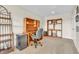 Bright office space with custom wooden desk, ample shelving, and neutral carpeting at 9231 E Poynter Dr, Morgantown, IN 46160