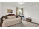 Cozy bedroom featuring a wooden-framed daybed with comfortable pillows, next to a window and seating at 9508 Oakley Dr, Indianapolis, IN 46260