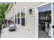 Exterior view of a cozy deck featuring a lounge chair and sliding glass door at 9508 Oakley Dr, Indianapolis, IN 46260