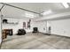 Clean, organized garage featuring ample storage space and overhead lighting at 9508 Oakley Dr, Indianapolis, IN 46260