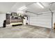 Spacious garage with overhead lighting and ample storage and workbench area at 9508 Oakley Dr, Indianapolis, IN 46260