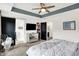 Main bedroom featuring ceiling fan, access to the walk-in closet and ensuite bathroom at 9508 Oakley Dr, Indianapolis, IN 46260