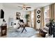 Bright home office with a decorative rug, modern desk and natural lighting at 9508 Oakley Dr, Indianapolis, IN 46260