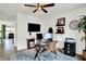 Home office featuring a glass desk, modern chair, and decor at 9508 Oakley Dr, Indianapolis, IN 46260
