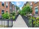 Neighborhood street featuring lovely brick townhomes with manicured lawns at 9508 Oakley Dr, Indianapolis, IN 46260