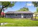 The back of the house features new vinyl siding and a walkout to a backyard patio at 9526 Burrwood Ct, Indianapolis, IN 46235
