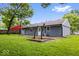 Back of house features new vinyl siding and walkout access to a backyard patio at 9526 Burrwood Ct, Indianapolis, IN 46235