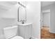 Bathroom features a modern vanity, white fixtures, and ample lighting at 9526 Burrwood Ct, Indianapolis, IN 46235