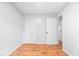 Bedroom featuring neutral paint, hardwood floors, and closet with doors at 9526 Burrwood Ct, Indianapolis, IN 46235