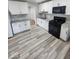 Bright kitchen boasting white cabinets, granite countertops, and updated black appliances at 9526 Burrwood Ct, Indianapolis, IN 46235