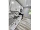 Modern kitchen featuring white cabinets, granite countertops, and stainless steel appliances at 9526 Burrwood Ct, Indianapolis, IN 46235