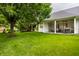 Serene backyard offering a covered patio, well-maintained lawn, and plenty of shade at 9678 Winter Way, Zionsville, IN 46077