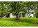 Green backyard with a covered patio providing ample space for outdoor activities at 9678 Winter Way, Zionsville, IN 46077