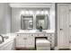 Bathroom with double vanity, modern lighting, and elegant mirrors at 9678 Winter Way, Zionsville, IN 46077