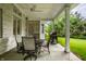 Inviting covered patio with a ceiling fan, outdoor dining set, and a barbecue grill at 9678 Winter Way, Zionsville, IN 46077