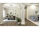 Stylish dining area showcasing hardwood floors and elegant lighting, perfect for entertaining guests at 9678 Winter Way, Zionsville, IN 46077