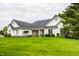 Beautiful one-story home showcasing its manicured lawn, mature trees, and classic brick facade at 9678 Winter Way, Zionsville, IN 46077
