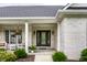 Inviting front porch featuring decorative columns and a beautifully landscaped entrance at 9678 Winter Way, Zionsville, IN 46077