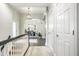 Upstairs hallway featuring hardwood floors, modern lighting, and access to multiple rooms at 9678 Winter Way, Zionsville, IN 46077