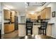 Spacious kitchen featuring wood cabinetry, granite countertops, and seating at the island at 9678 Winter Way, Zionsville, IN 46077