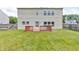 A backyard featuring a two-story home and a wooden deck at 10187 Yosemite Ln, Indianapolis, IN 46234