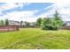 A green and spacious backyard with wood fence and deck at 10187 Yosemite Ln, Indianapolis, IN 46234