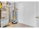 A basement with a furnace and a hot water heater on carpeted flooring at 10187 Yosemite Ln, Indianapolis, IN 46234