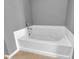 Bathroom features a large soaking tub with tile surround and chrome fixtures at 10187 Yosemite Ln, Indianapolis, IN 46234
