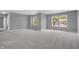 Spacious bedroom featuring plush carpeting, neutral paint, and double windows for natural light at 10187 Yosemite Ln, Indianapolis, IN 46234