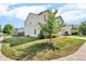 Two-story home surrounded by lush greenery and a well-manicured lawn, situated in a Gathering-friendly neighborhood at 10187 Yosemite Ln, Indianapolis, IN 46234