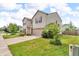 Well-manicured lawn and landscaping surround this beautiful home with a two car garage at 10187 Yosemite Ln, Indianapolis, IN 46234