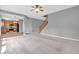 Open-concept living room flowing into the kitchen, with gray walls and modern appliances at 10187 Yosemite Ln, Indianapolis, IN 46234