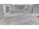 The spacious loft features neutral carpeting, bright gray walls, and access to multiple bedrooms at 10187 Yosemite Ln, Indianapolis, IN 46234