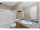 Bathroom with tile bath and shower combo with single sink vanity at 10427 Apple Creek Dr, Indianapolis, IN 46235