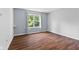 Bedroom features a large window with natural light and neutral walls at 10427 Apple Creek Dr, Indianapolis, IN 46235