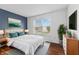 Comfortable bedroom with hardwood floors, natural light, and contemporary decor at 10427 Apple Creek Dr, Indianapolis, IN 46235