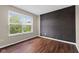 Bedroom features hardwood flooring, natural light and neutral walls at 10427 Apple Creek Dr, Indianapolis, IN 46235